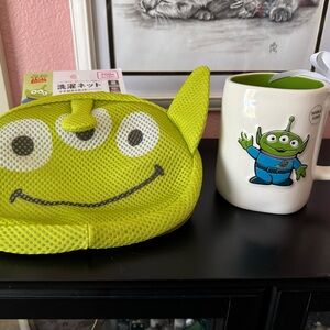 Both NWT Rae Dunn Pixar Alien Mug and Pixar Alien Laundry Net